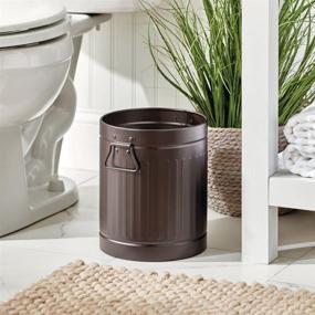 img 3 attached to 🗑️ mDesign Vintage Farmhouse Round Metal Small Trash Can Wastebasket with Handles for Bathrooms, Powder Rooms, Kitchens, Home Offices - Steel - Bronze