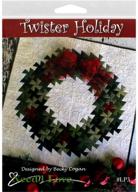 twister needlelove holiday 🧵 with the primitive pinwheels tool pattern logo