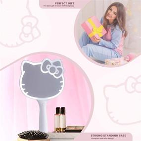 img 3 attached to 💡 Optimize Your Search: Hello Kitty LED Handheld Mirror with Adjustable Brightness & Standing Base for Makeup Vanity