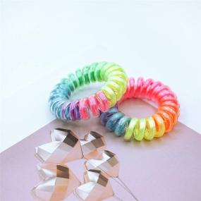 img 1 attached to 9-Piece Rainbow Spiral Traceless Hair Rings - Phone Cord Hair Ties for Women, Girls, and Kids - Coil Ponytail Holders for Comfortable and Wear-Resistant Hairstyles