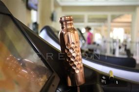 img 3 attached to Cretoni Copperlin Classic-Series Pure Copper Water Bottle: Sleek Honeycomb Design: Ideal Ayurvedic Copper Container for Sports, Fitness, Yoga, Natural Health Benefits (900ml/30oz)