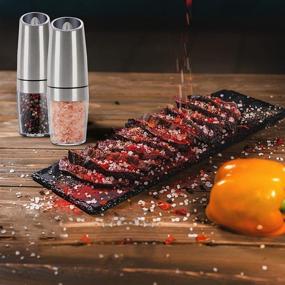 img 2 attached to Gravity Electric Pepper and Salt Grinder Set: Adjustable Coarseness, LED Light, One Hand Operation - Stainless Steel, 2 Pack (Silver)