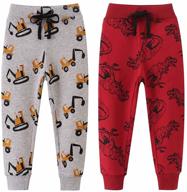 🦖 dinosaur-inspired aowkulae elastic drawstring sweatpants for boys: comfortable clothing and pants for kids logo