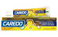 caredo kid's only cure tooth decay cavities toothpaste: repairing dental caries for children, fruit flavor - 1.75 oz tubes logo