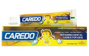 img 4 attached to Зубная паста CAREDO Kid's ONLY Cure от кариеса и зубных полостей: восстанавливающая зубной кариес для детей, с фруктовым вкусом - тюбики по 1,75 унции.