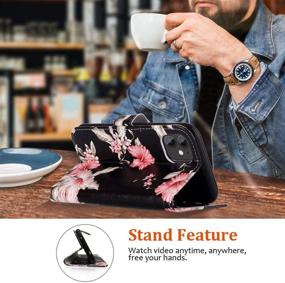 img 3 attached to JanCalm iPhone 11 Wallet Case: Floral Pattern PU Leather with Wrist Strap, Card/Cash Slots, Stand Feature and Flip Cover – Black/Flower