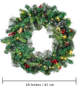 img 1 attached to 🎄 Snow Flocked 24” Christmas Wreath with Pre-lit 50 LED Lights for Front Door - Red Berries, Pine Cones - Battery Operated