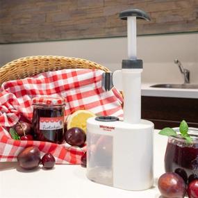 img 2 attached to 🍒 Efficient and Mess-Free: Westmark 40232260 2-in-1 Plum Pitter Stoner with Stainless Steel Plunger and Waste Container