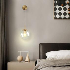 img 1 attached to Minimalist Adjustable Raw Brass Round Glass Wall Light Fixture in Mid Century Modern Style - Reading Lamp with Clear Lampshade