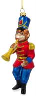 monkey nutcracker trumpet christmas ornament logo