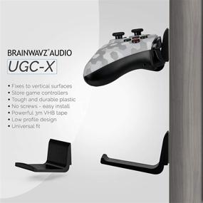 img 1 attached to Universal Game Controller Holder Wall Mount Stand (2 Pack) for Xbox One, 🎮 Nintendo Switch, PS4/PS5, Steam PC - No Screws, Stick-On, Black - By Brainwavz (UGC-X)