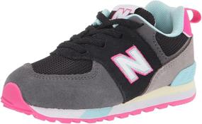 img 4 attached to 💯 Classic Style Meets Comfort: New Balance Kids' 574 V1 Lace-Up Sneaker