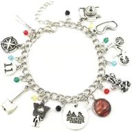 eccentric 80s horror show inspired ivy & clover stamped medallion charm bracelet: unleash strange style logo