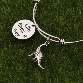 img 2 attached to Stylish BNQL Jurassic Park Charm Bracelet: Celebrate Resilience with the Life Finds a Way Bracelet