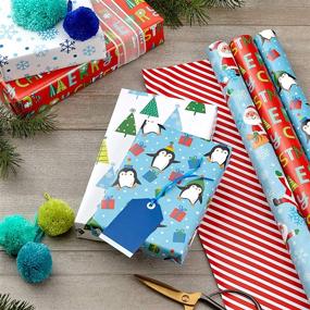 img 3 attached to 🎄 Hallmark Adorable Reversible Christmas Wrapping Paper for Children (3 Rolls: 120 sq. ft. total) Penguins, Santa Claus, Trees, Stripes, Snowflakes, 'Merry Christmas'