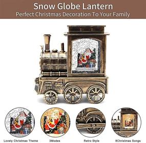 img 3 attached to 🎅 Musical Christmas Snow Globe Water Lantern - Battery Operated & USB Powered, 6 Hr Timer, 8 Songs, Santa in Bronze Train - Home Holiday Decor for Kids