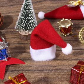 img 2 attached to 🎅 ONEYIM 10pcs Mini Santa Hat Wine Bottles Cover: Festive Home Christmas Decorations