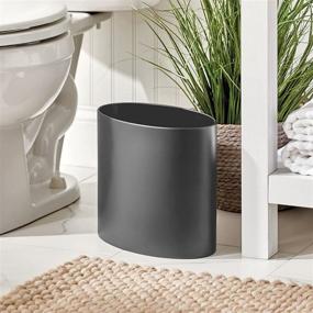 img 3 attached to 🗑️ mDesign Oval Metal Decorative Small Trash Can Wastebasket, Garbage Bin for Bathrooms, Kitchens, Home Offices, Dorm Rooms - Solid Stainless Steel - Graphite Gray