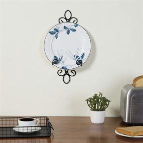 img 1 attached to MyGift Vintage Black Metal Decorative Scrollwork Wall-Mounted Vertical Plate Holder Rack for Plates Up to 8