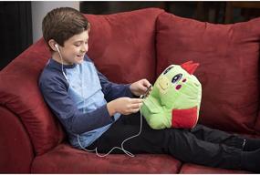 img 1 attached to 🦕 Plush Play Pillow - Danny The Dinosaur - with Built-in Shelf for Devices or Books - Large Storage Pockets - Snuggly & Soft - MyPadimals