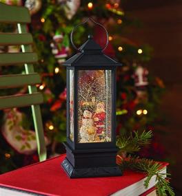 img 1 attached to 🎅 11 Inch Black Lighted Snow Globe Lantern: RAZ Imports Holiday Water Lantern with Santa and Snowman