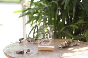 img 2 attached to 🌿 UNIQOOO Wedding Table Numbers 1-20 - Acrylic with Wood Stands, 4x6 inch, Botanical Olive Wreath Design, Clear Table Number Signs and Holders, Ideal for Reception, Centerpiece Decoration, Event, Party
