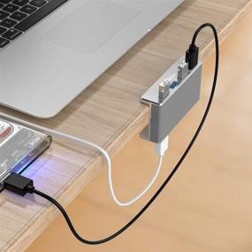 img 2 attached to 🔌 Rekidm Powered USB Hub 3.0 with Extra Power Supply Port & Adjustable Clamp - Space-Saving Silver Desktop Hub for PC, Computer and Table Edge
