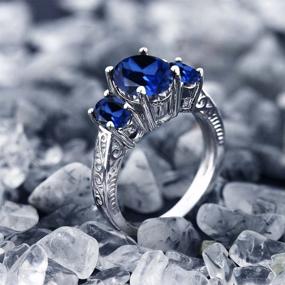 img 1 attached to 💍 Изысканное кольцо с 3 камнями Gem Stone King из 925 стерлингового серебра с синим созданным сапфиром для обручения женщин - овальный крой 3,51 карата, размеры 5, 6, 7, 8, 9 доступны