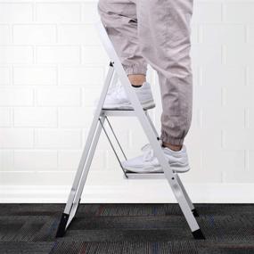 img 1 attached to Delxo 2 Step Stool with Handgrip - Lightweight Folding Step Stool, Heavy Duty 2 Step Ladder for Home, Kitchen, and Office - Portable 2 Step Steel Ladder with 330lbs Capacity - White (2 Feet)