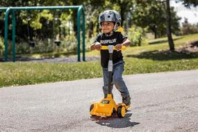 img 3 attached to CAT Toddler Kick Scooter by Kid Trax - Adjustable Height Handlebars, Lean to Steer Technology, Removable Bulldozer-Style Scoop - Kids 3 Years and Older