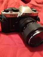 📸 nikon fm-10 35mm slr camera kit: high-quality images with 35-70mm f3.5-4.8 zoom lens & camera case logo