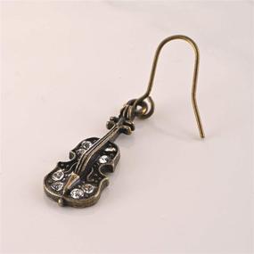 img 1 attached to 🎶 Antique Bronze Musical Instrument Dangle Earrings by Spinningdaisy: Classic Melodies for Fashion Enthusiasts