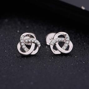 img 1 attached to 💍 Sterling Silver Cubic Zirconia Love Knot Stud Earrings - dainty, twisted design for women and girls