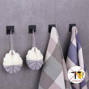img 2 attached to BEIGEEWY 4 Pack Matte Black Adhesive Towel Hooks - Premium Heavy Duty Sticky Wall Hangers for Bathrooms - No Nails Hanging Hooks for Towels