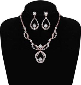 img 1 attached to 💎 ORAZIO Crystal Bridal Jewelry Set: Stunning Rhinestone Necklace, Earrings, Bracelet, and Comb for Women's Prom, Wedding, and Bridesmaids - Vintage Elegance