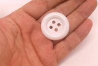 arctic white sewing buttons in large size logo