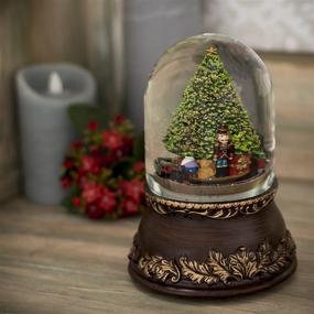 img 2 attached to 🌲 Captivating Roman, Inc. Musical Tree with Train Dome Globe: A Melodious Decor Item