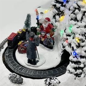 img 1 attached to 🎅 Polyresin Christmas House Collectible Figurine with Dual Power Source, USB and Battery - Moving Train and Santa Photo, XH93408