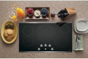 img 3 attached to 🍳 GE PP7036SJSS 36 Inch Smoothtop Electric Cooktop with 5 Radiant Elements, Sync Technology, Versatile Burner Options, Keep Warm Setting, Control Lock Capability, Red LED Backlit Knobs, ADA Compliant Fits Guarantee