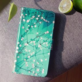 img 1 attached to 🌸 JanCalm Plum Blossom iPhone 8 кошелек-чехол: Стильный чехол из PU-кожи с ремешком на запястье, держателем для карт и функцией подставки.