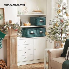 img 3 attached to 🎁 SONGMICS Set of 3 Foldable Christmas Storage Boxes with Lid and Labels, Holiday Storage Bins with Snowflakes Pattern, Non-Woven Fabric, 11.8 x 15.7 x 9.8 Inches, Green URFB003G02