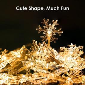 img 2 attached to 🎄 MoKo Snowflake String Lights: 10m/33ft 100 LED Waterproof Fairy Lights with 2 Lighting Modes for Halloween Christmas Weddings Birthday Family School Parties Décor - Warm White