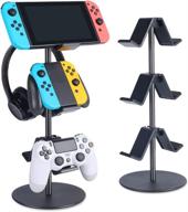 🎮 smart black 3-tier controller stand with headphone holder by keljun - multi adjustable game controller headset hanger for universal gaming pc accessories, xbox, ps4, ps5, nintendo switch logo