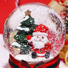 img 1 attached to 🎅 XXMANX 80 MM Christmas Snow Globe - 8 Music, 4 Color Lights Santa Music Box Decor for Girls, Boys, Kids - Granddaughters, Babies Birthday Gift - Musical, Resin/Glass (Manual Snow Drift)