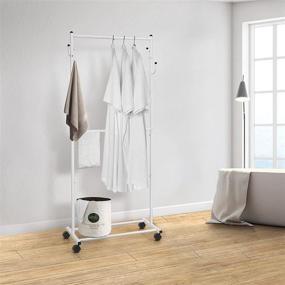 img 1 attached to White Double Rod Clothes Garment Rack with Wheels, 4 Hooks - Simple Trending Rolling Clothing Organizer