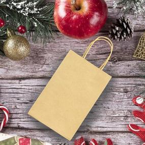 img 2 attached to 🎁 Pack of 100 Christmas Kraft Paper Bags - Brown Gift Bags with Handles Bulk for Christmas Gift Giving, DIY Party Bags, Christmas Party Favors - 5.25 * 3.75 * 8 Inches