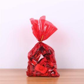 img 2 attached to 🎁 Рулон целлофановой упаковки - полупрозрачный красный, длинной 100 футов, шириной 16 дюймов, с толщиной 2.3 мл - идеально подходит для подарочных корзин, угощений, конфет, печенья - блестящая, красочная целлофановая упаковка для рождественских праздников