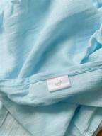 blue muslin baby swaddle blanket logo