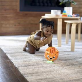 img 2 attached to Музыкальная игрушка Baby Einstein Tinker's Crawl Along Songs для качания с подсветкой, подходит для детей от 6 месяцев и старше.