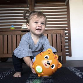 img 1 attached to Музыкальная игрушка Baby Einstein Tinker's Crawl Along Songs для качания с подсветкой, подходит для детей от 6 месяцев и старше.